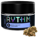 A glass jar of RYTHM cannabis, showcasing the Gelonade strain, alongside a small bud.