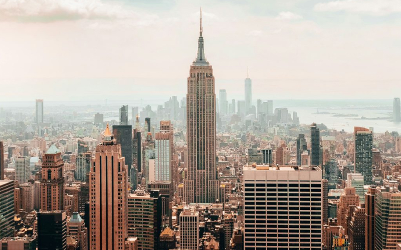 Aerial view of the New York City skyline with the Empire State Building at the center.