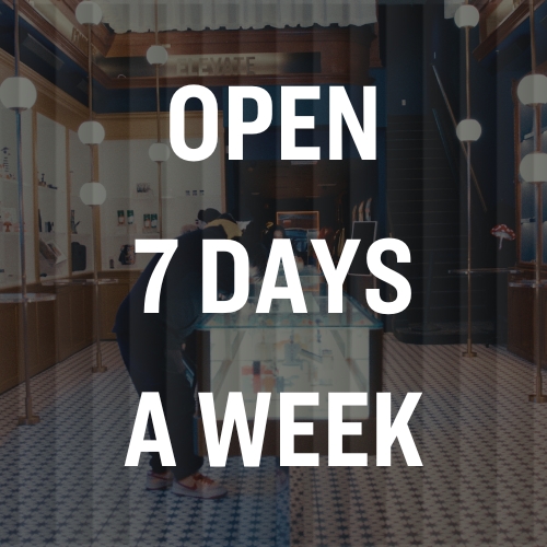 Store interior with modern decor and text overlay: OPEN 7 DAYS A WEEK.