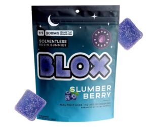 A bag of Blox Slumber Berry gummies with two purple gummies displayed beside the package.