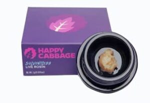 A container of light brown concentrate next to a purple Happy Cabbage Solventless Live Rosin box.