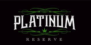 Platinum Reserve logo with a small cannabis leaf and green decorative accents on a black background.